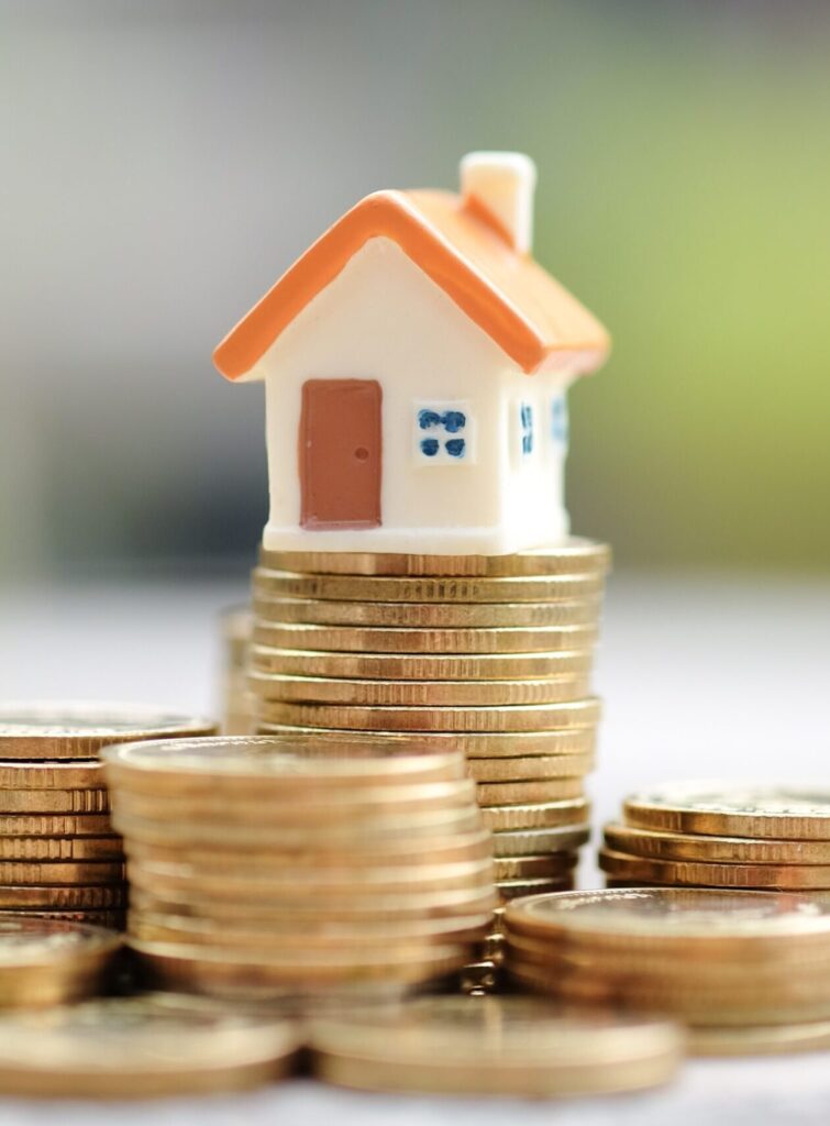 Photo of mini house on coins